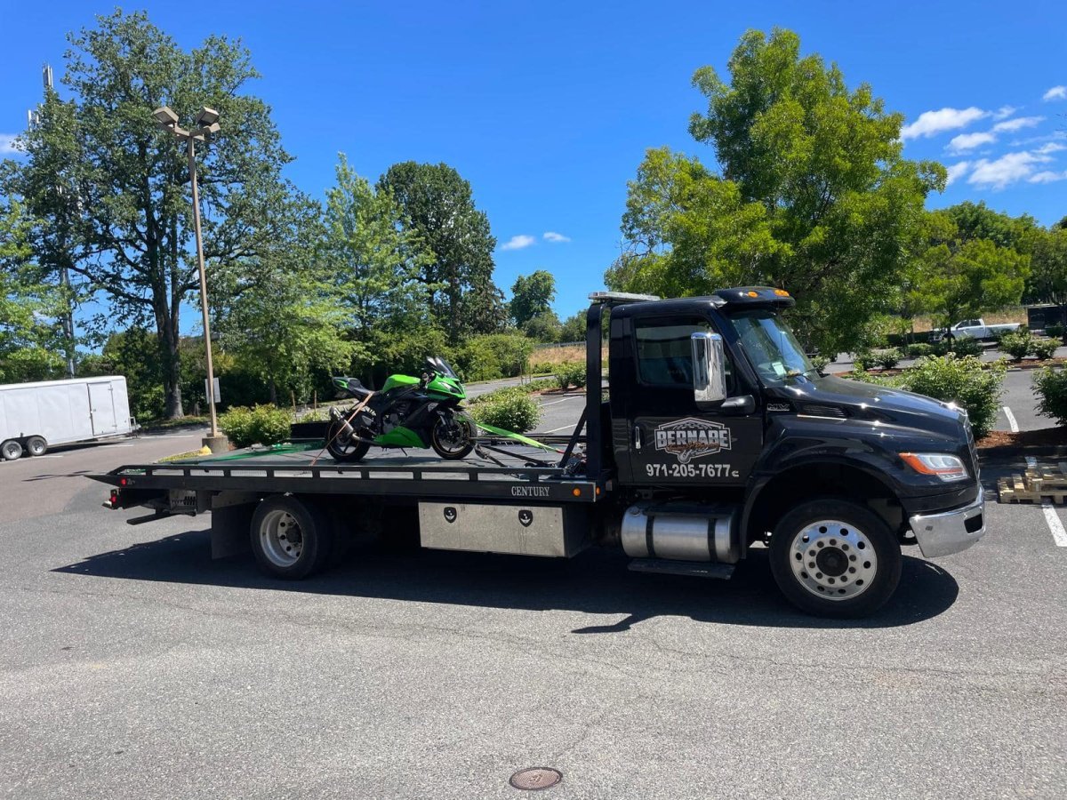 Bernabe Towing truck providing roadside vehicle towing